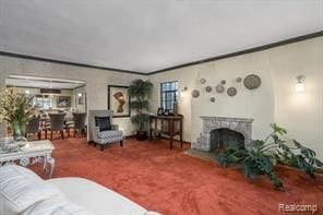 carpeted living room with ornamental molding