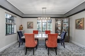 dining area featuring a wealth of natural light and a notable chandelier