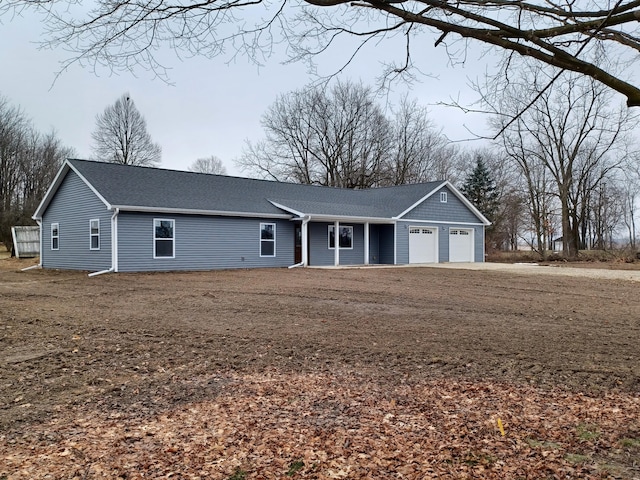 ranch-style house featuring a garage