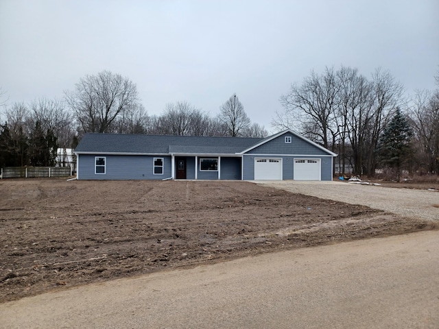 ranch-style house featuring a garage