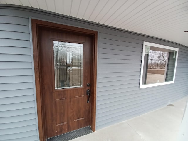 property entrance featuring covered porch