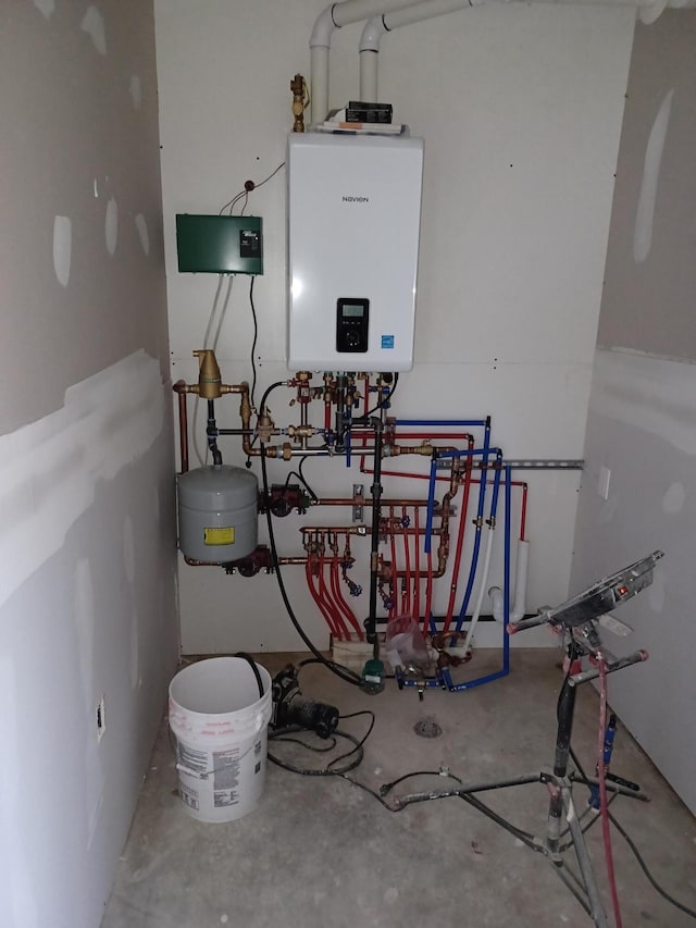 utility room with tankless water heater