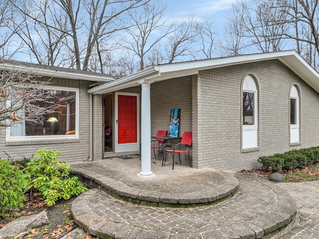 doorway to property featuring a patio area