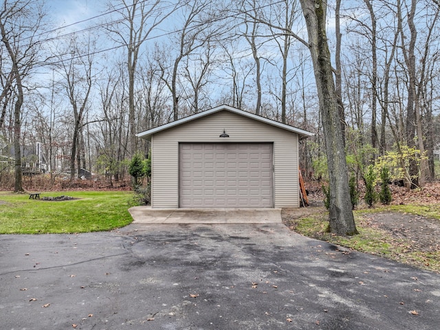 garage featuring a lawn