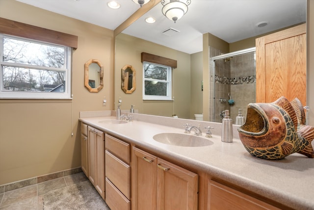 bathroom with vanity, an enclosed shower, tile patterned flooring, and toilet