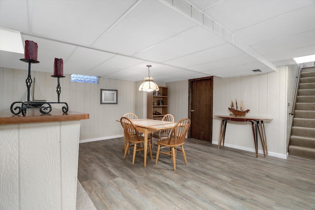 dining space with hardwood / wood-style floors