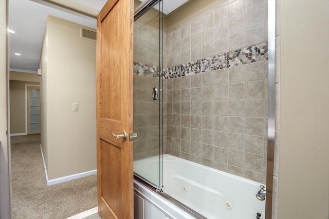 bathroom with shower / bath combination with glass door