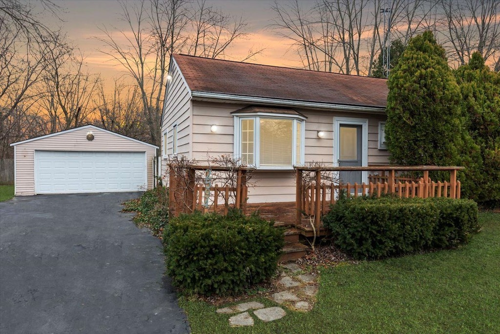 view of front of house featuring an outdoor structure and a garage