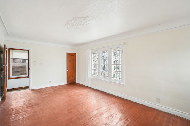 empty room with light hardwood / wood-style flooring