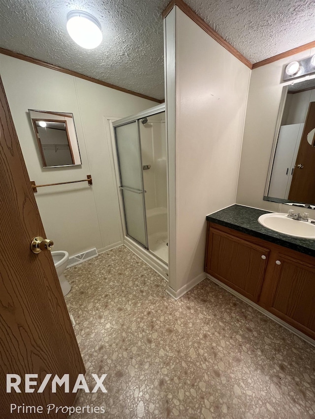 bathroom with crown molding, an enclosed shower, vanity, a textured ceiling, and vaulted ceiling