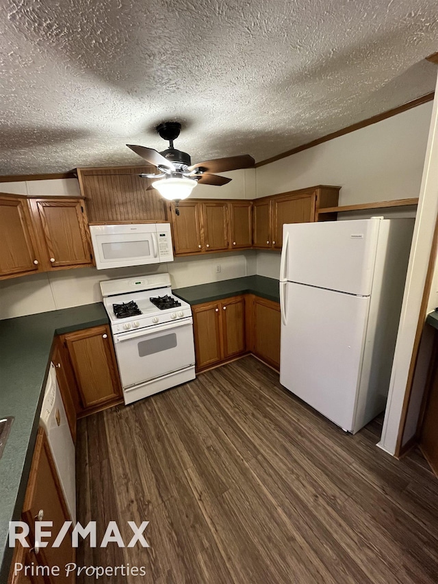 kitchen featuring crown molding, dark wood-type flooring, a textured ceiling, and white appliances