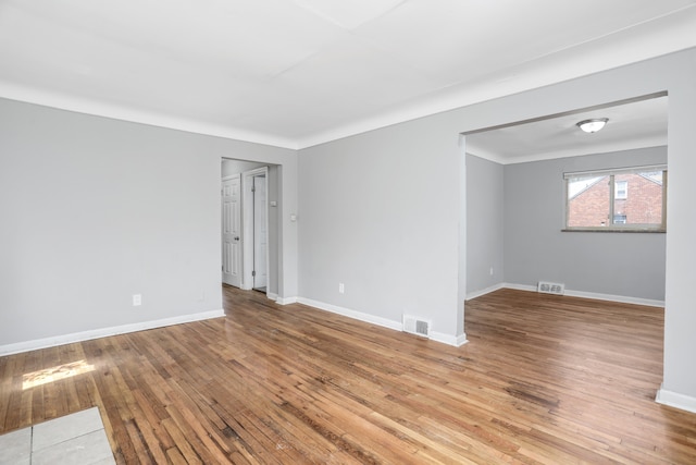 unfurnished room with light hardwood / wood-style floors