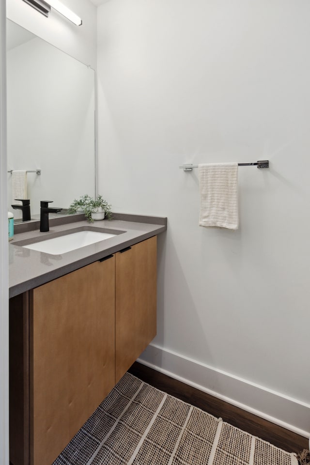 bathroom featuring hardwood / wood-style floors and vanity