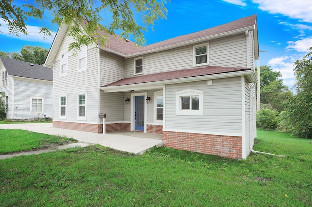 front of property with a patio area and a front yard