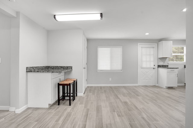 unfurnished living room with light hardwood / wood-style floors