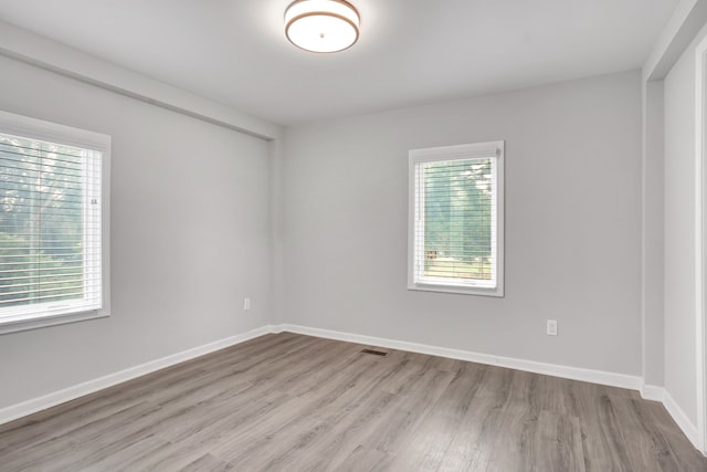 spare room with light wood-type flooring