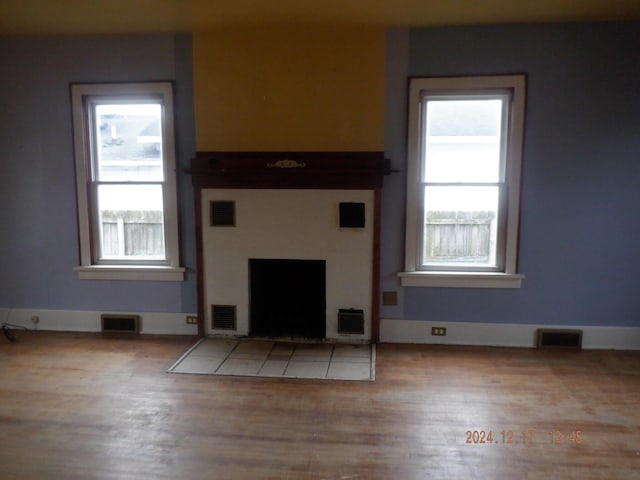 unfurnished living room featuring light wood-type flooring