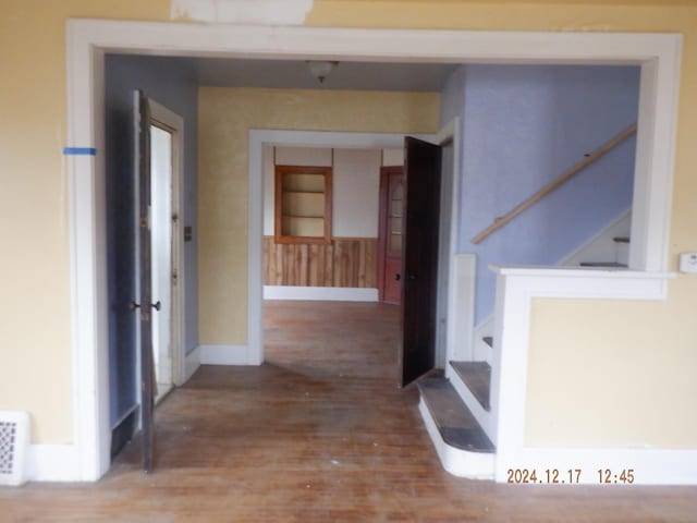 corridor featuring wood-type flooring