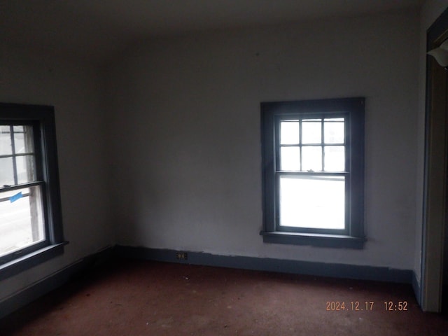 empty room with dark carpet