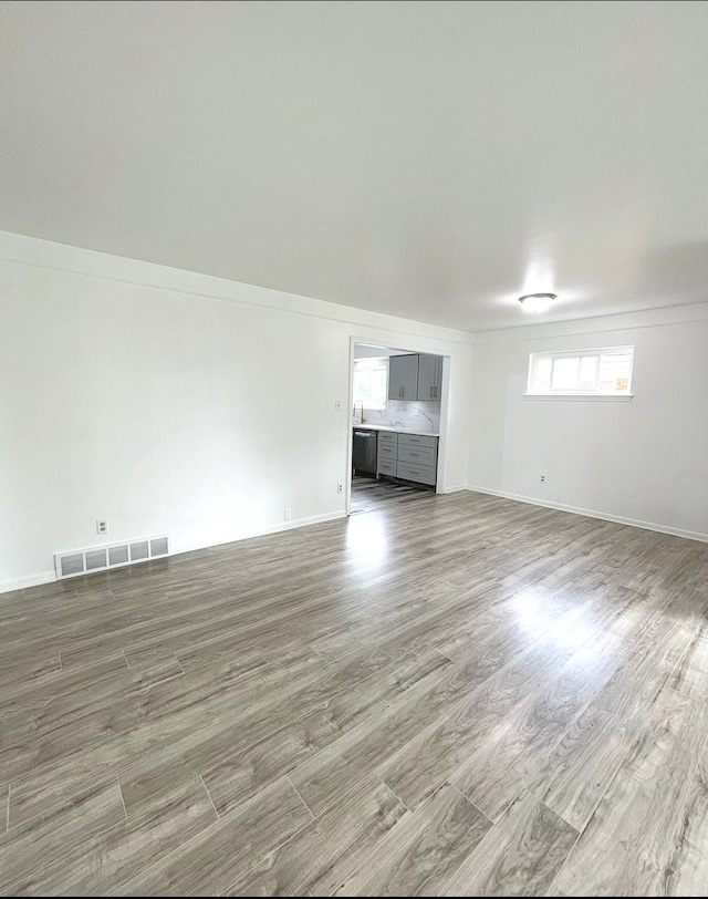 unfurnished living room with hardwood / wood-style floors