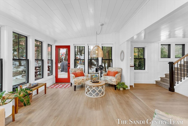 sunroom with wooden ceiling and vaulted ceiling