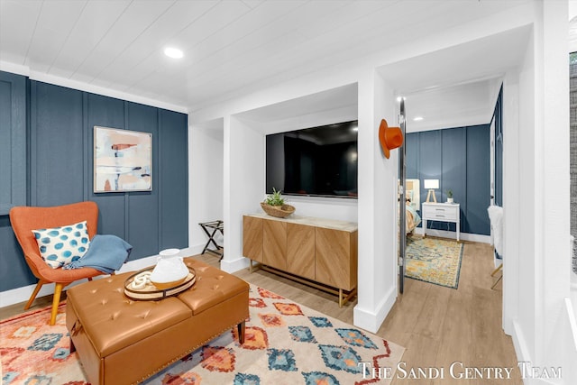 living area with light hardwood / wood-style floors