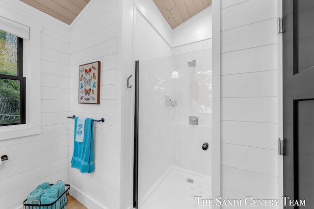 bathroom with wood ceiling, vaulted ceiling, and an enclosed shower