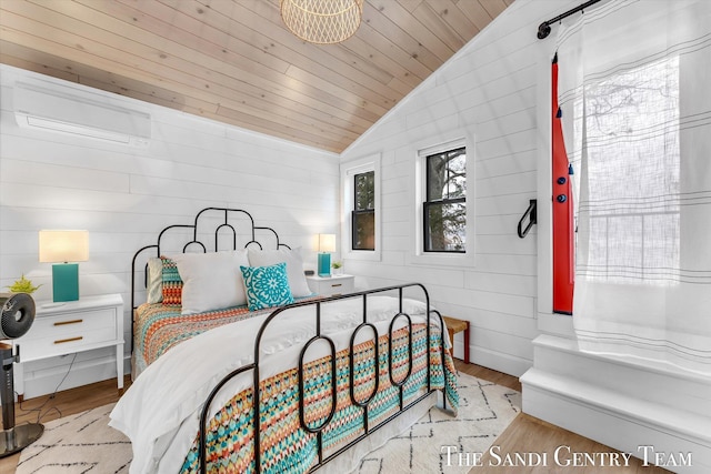 bedroom featuring wood ceiling, light wood-type flooring, and vaulted ceiling