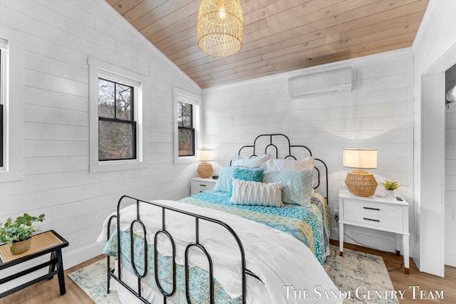 bedroom with wooden ceiling, an inviting chandelier, lofted ceiling, light wood-type flooring, and a wall unit AC