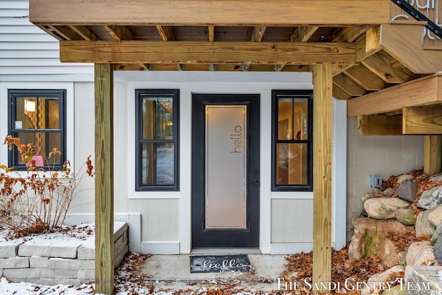 view of snow covered property entrance