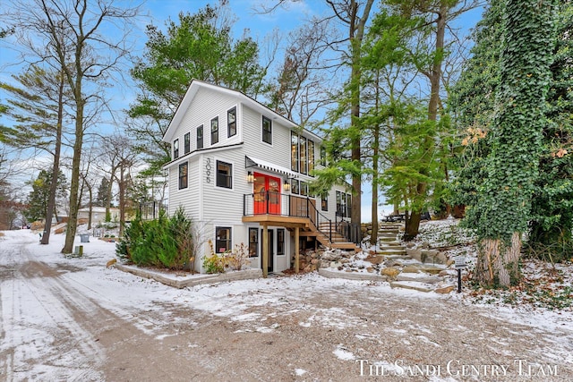 view of front of house with a wooden deck