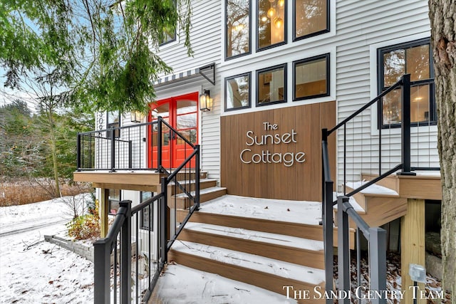 view of snow covered property entrance