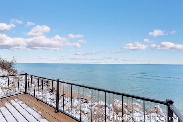 wooden deck with a water view