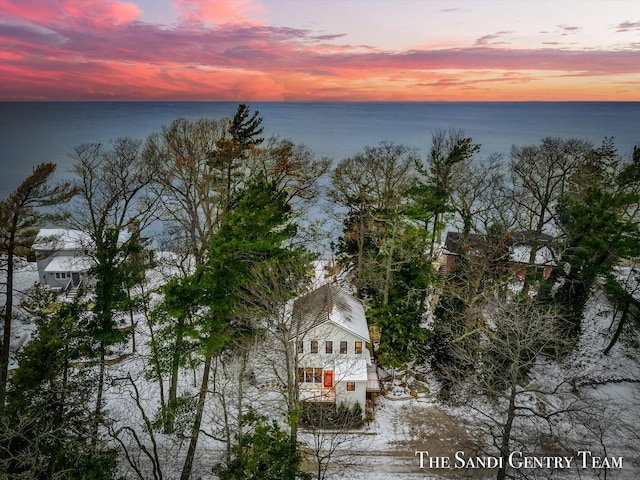 aerial view at dusk with a water view