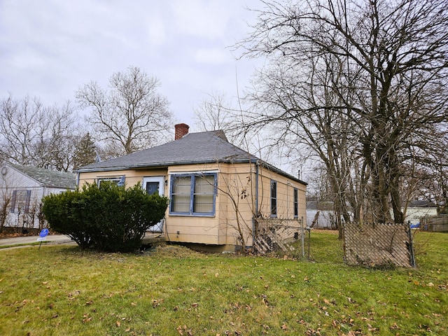 view of property exterior with a lawn