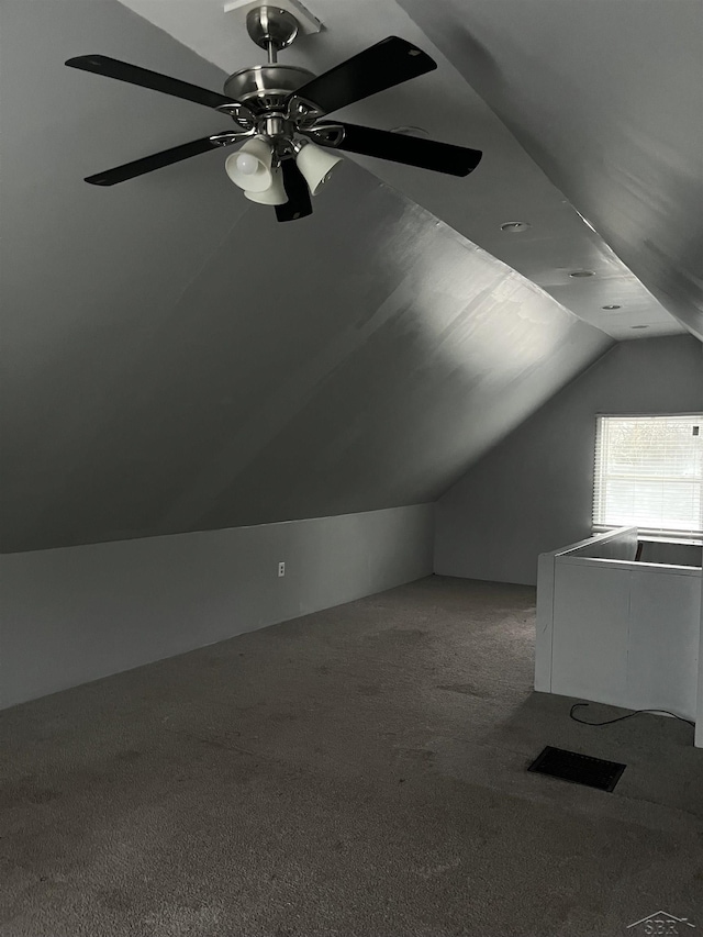 bonus room with carpet flooring, ceiling fan, and vaulted ceiling