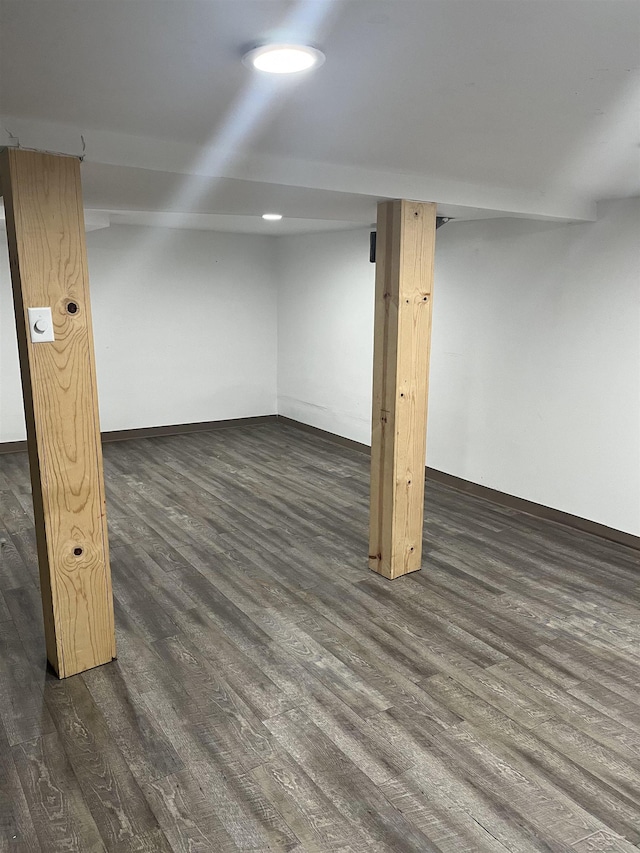 basement featuring dark hardwood / wood-style flooring