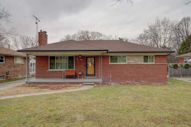 view of front of home with a front yard and a porch