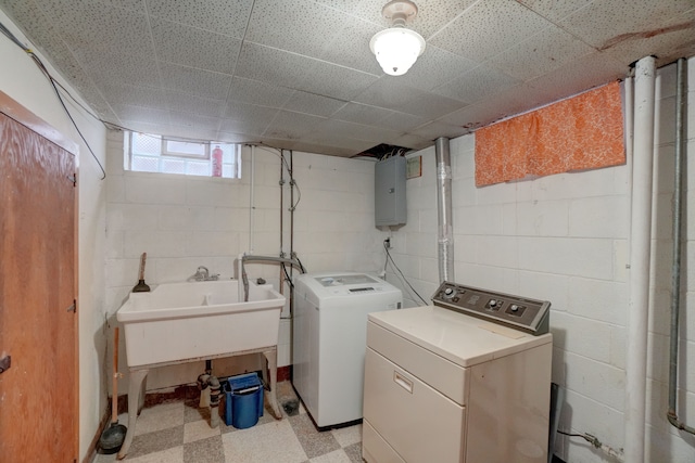 laundry room with independent washer and dryer, electric panel, and sink