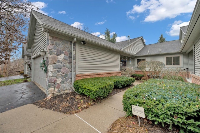 view of property exterior with a garage