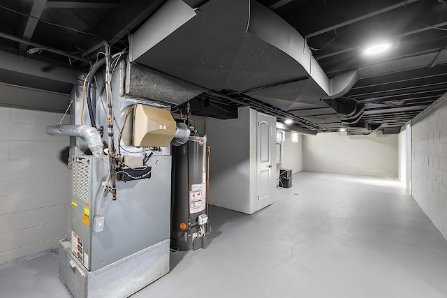 basement featuring heating unit and gas water heater