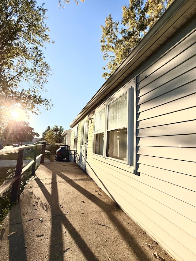 view of side of home featuring a patio area