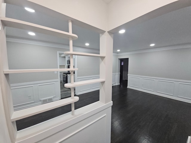 kitchen featuring dark hardwood / wood-style floors and ornamental molding