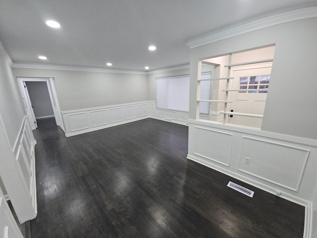 unfurnished room featuring dark hardwood / wood-style flooring and crown molding