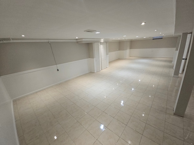 basement with light tile patterned flooring