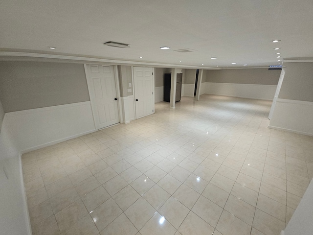 basement with light tile patterned flooring