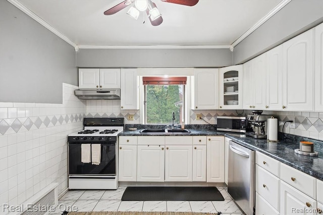 kitchen with white cabinets, appliances with stainless steel finishes, crown molding, and sink