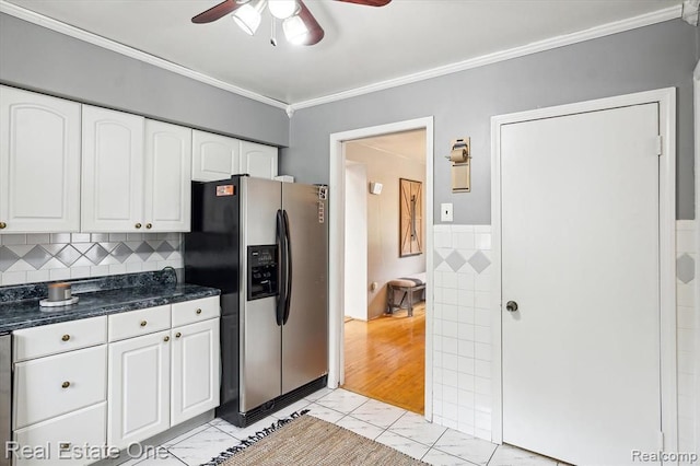 kitchen featuring ceiling fan, stainless steel refrigerator with ice dispenser, crown molding, light hardwood / wood-style floors, and white cabinets