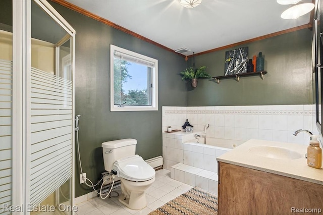 bathroom with vanity, tile patterned floors, toilet, ornamental molding, and tiled tub