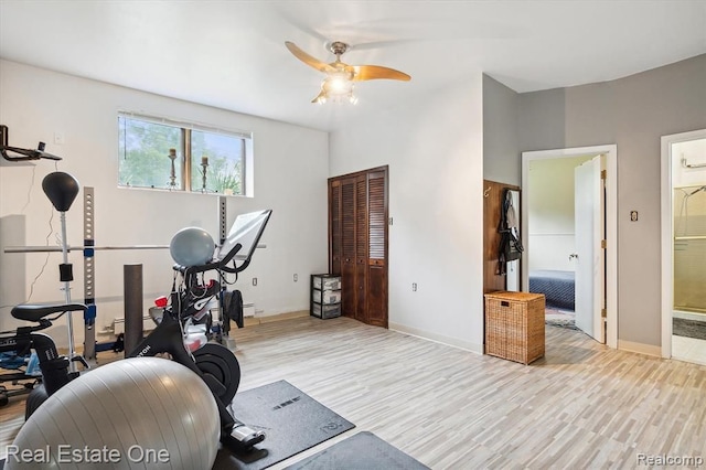 exercise area with ceiling fan and light hardwood / wood-style floors